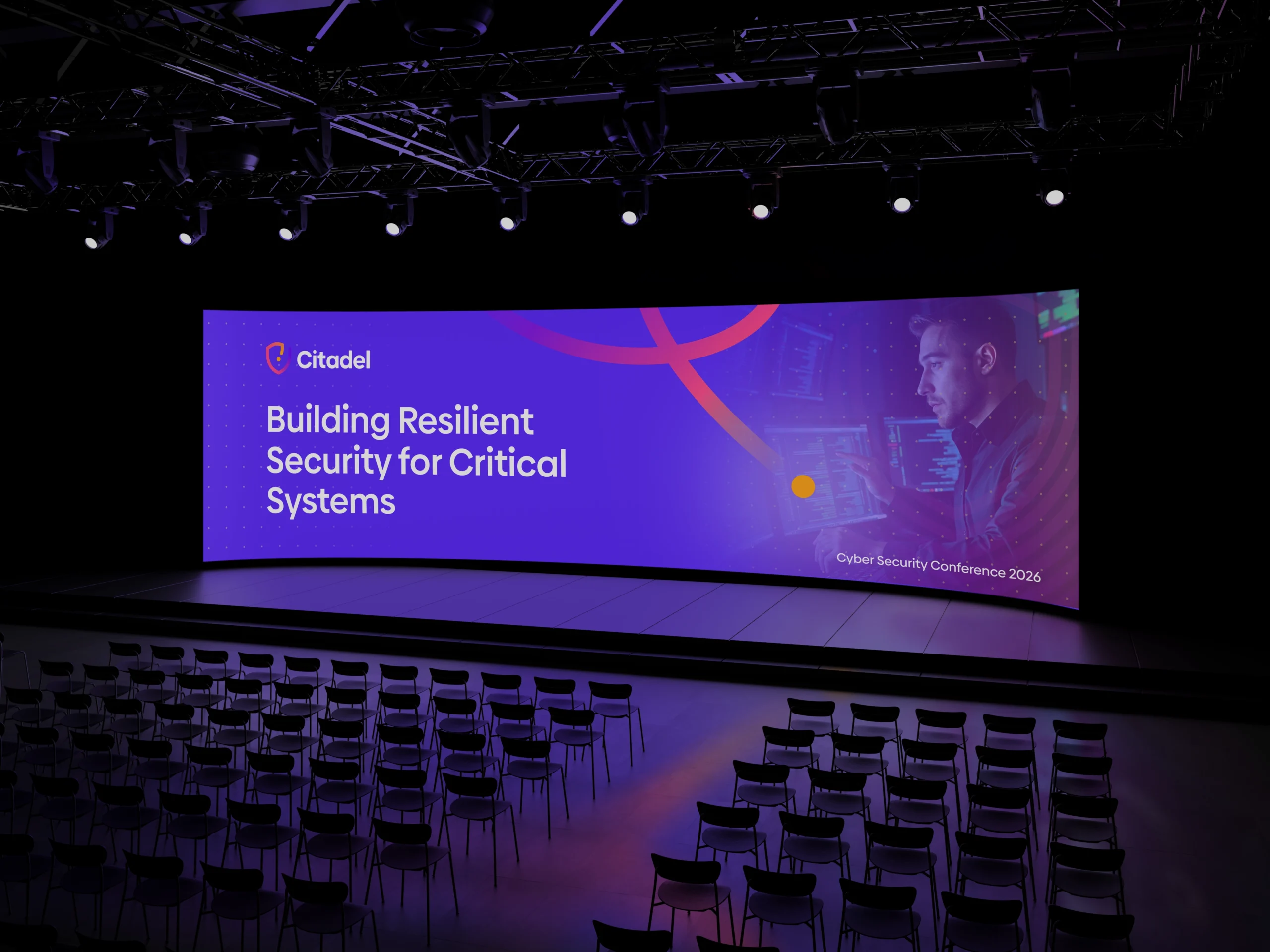 יישום שפה גרפית וזהות ויזואלית של Citadel Cyber Security על מסכי ענק בכנס, בעיצוב K2 Design.